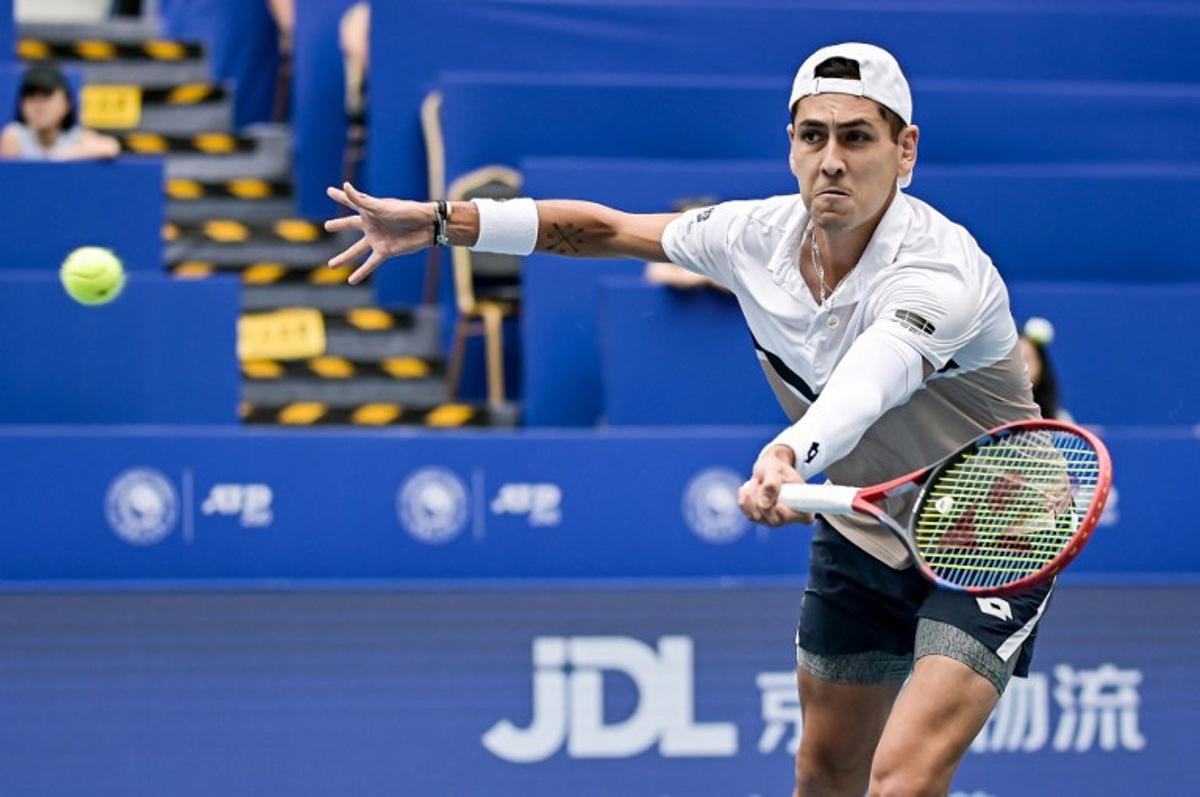 Chile's Alejandro Tabilo hits a return to Australia's Christopher O'Connell during their men's singles quarter-final match at the Chengdu Open tennis tournament in Chengdu, in China's southwest Sichuan province on September 21, 2025. STR / AFP