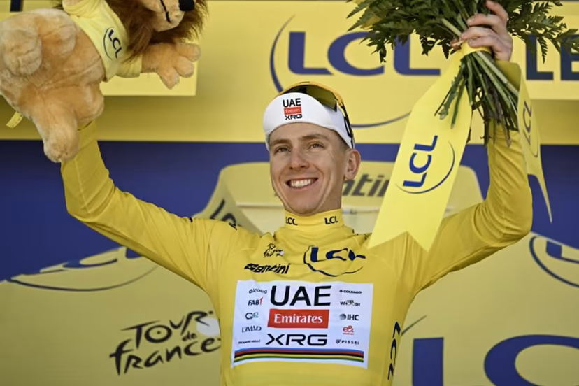 UAE Team Emirates - XRG's Slovenian rider Tadej Pogacar celebrates on the podium with the overall leader's yellow jersey after the 3rd stage of the 113th edition of the Tour de France cycling race, 196 km between Granollers and Les Angles in southern France, on July 6, 2026. Loic VENANCE / AFP