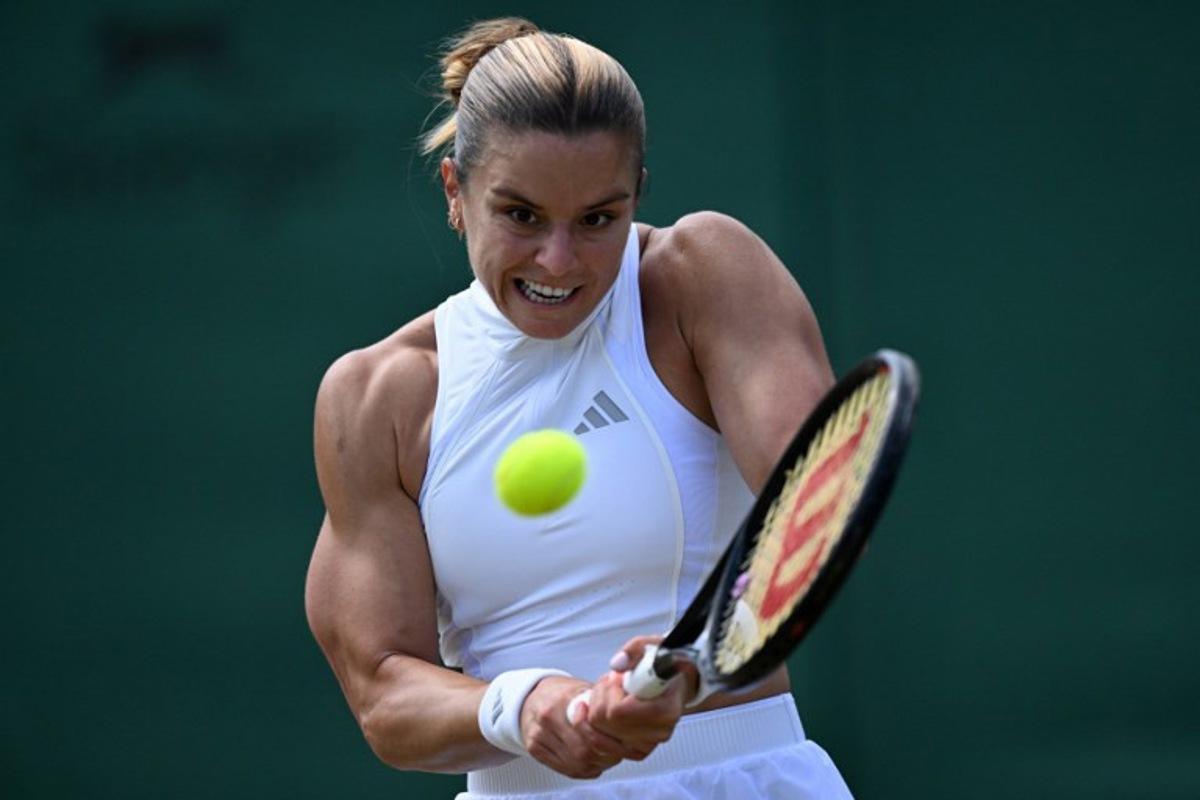 Greece's Maria Sakkari returns against Italy's Jasmine Paolini during their women's singles third round tennis match on the sixth day of the 2026 Wimbledon Championships at The All England Lawn Tennis and Croquet Club in Wimbledon, southwest London, on July 4, 2026. Kirill KUDRYAVTSEV / AFP