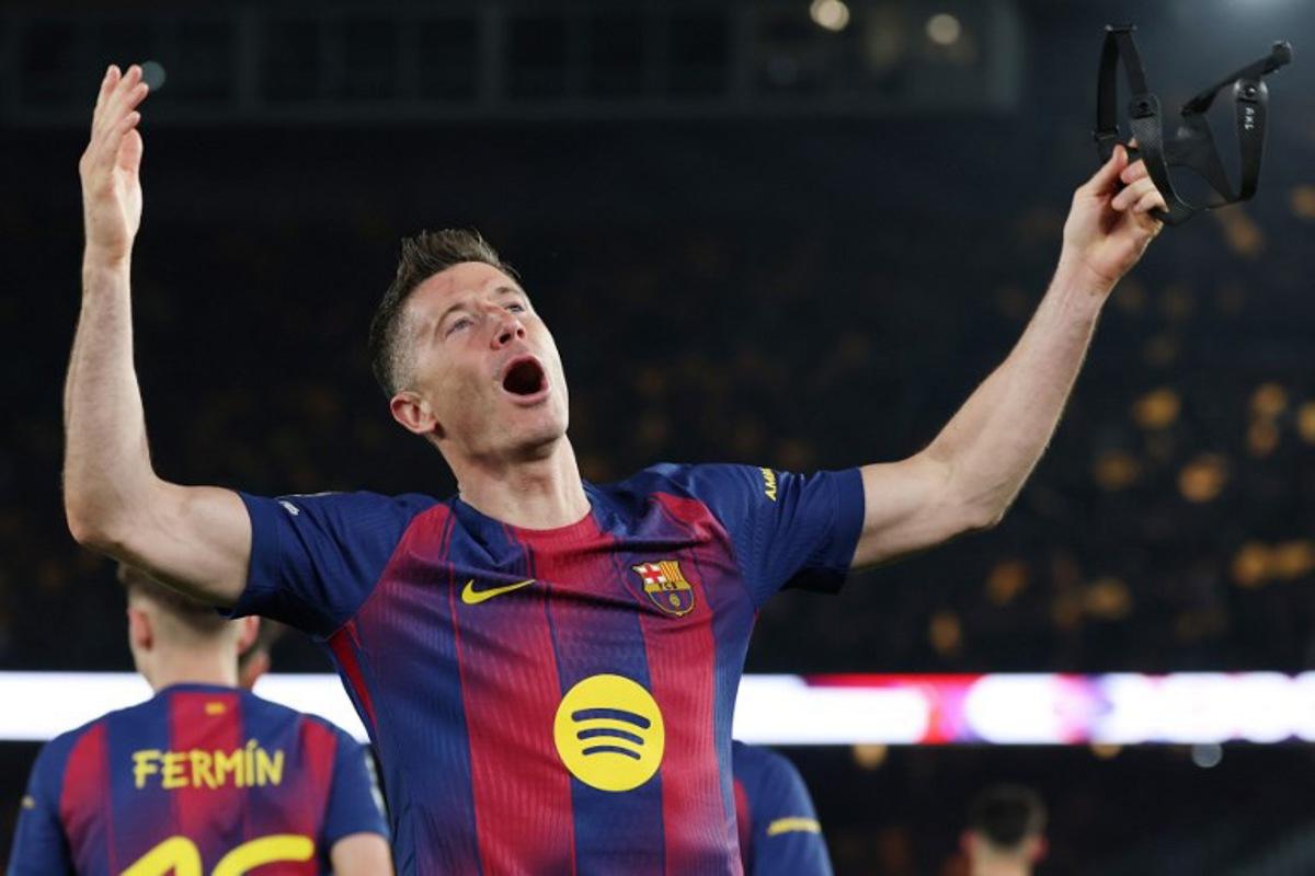 Barcelona's Polish forward #09 Robert Lewandowski celebrates scoring his team's fifth goal during the UEFA Champions League last 16 second leg football match between FC Barcelona and Newcastle United at the Camp Nou stadium in Barcelona, on March 18, 2026. Lluis GENE / AFP