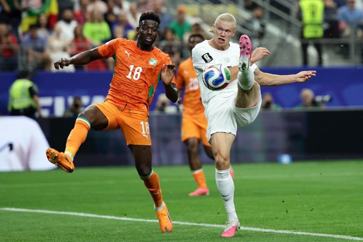 Norway's forward #09 Erling Braut Haaland (R) kicks the ball next to Ivory Coast's midfielder #18 Ibrahim Sangare during the 2026 World Cup round of 32 football match between Ivory Coast and Norway at the Dallas Stadium in Arlington on June 30, 2026. Aric Becker / AFP