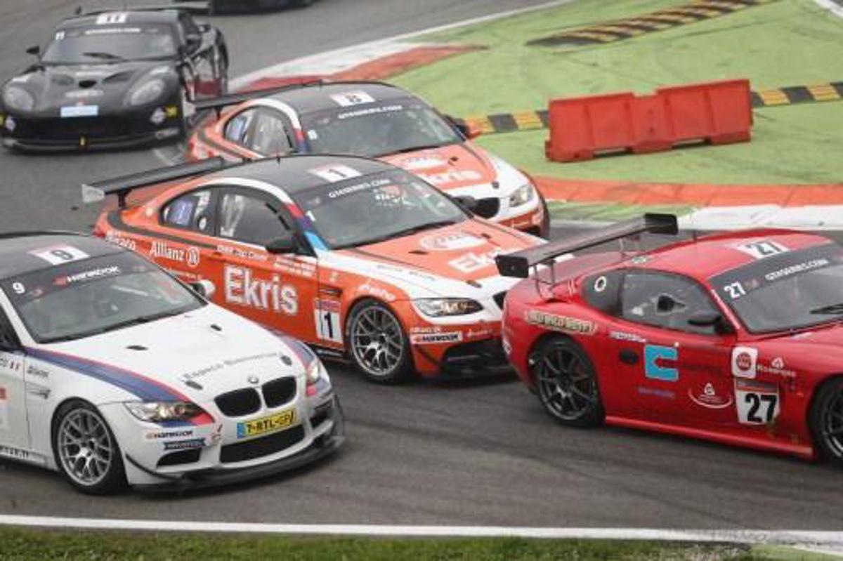 Prince Bernhard van Oranje of the Netherlands and team mate Ricardo van der Ende (car number 1-C) compete to win the GT4 European series race at the Autodromo Nazionale in Monza on October 26, 2014. AFP PHOTO / FABRIZIO RADAELLI ***ITALY OUT*** ***ITALY OUT***