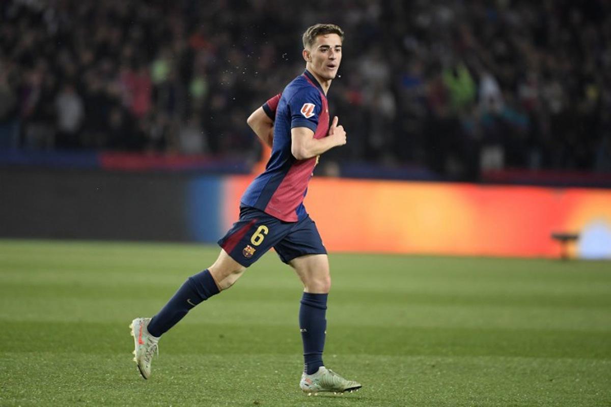 Barcelona's Spanish midfielder #06 Pablo Gavi celebrates scoring their first goal during the Spanish league football match between FC Barcelona and Real Betis at the Estadi Olimpic Lluis Companys in Barcelona, on April 5, 2025. Josep LAGO / AFP