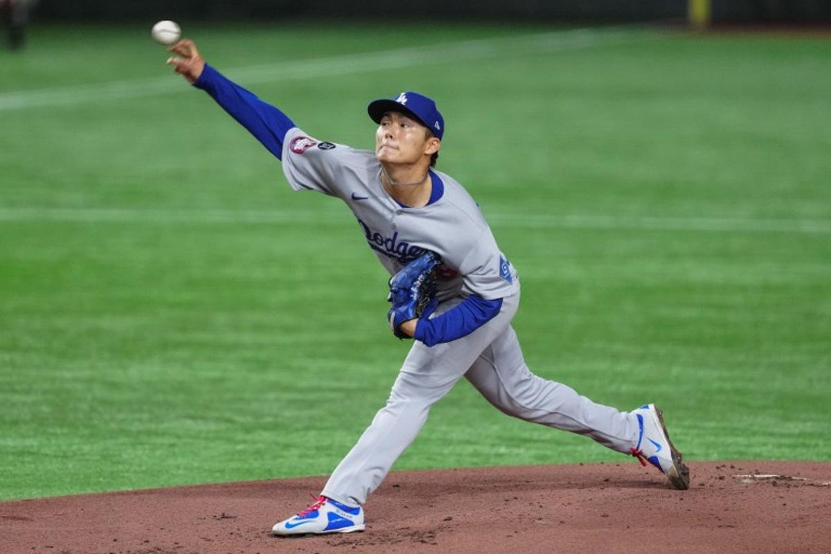Los Angeles's Yoshinobu Yamamoto pitches in the first inning during the baseball game between Los Angeles Dodgers and Chicago Cubs in the MLB Tokyo Series outside of the Tokyo Dome in Tokyo on March 18, 2025. Yuichi YAMAZAKI / AFP
