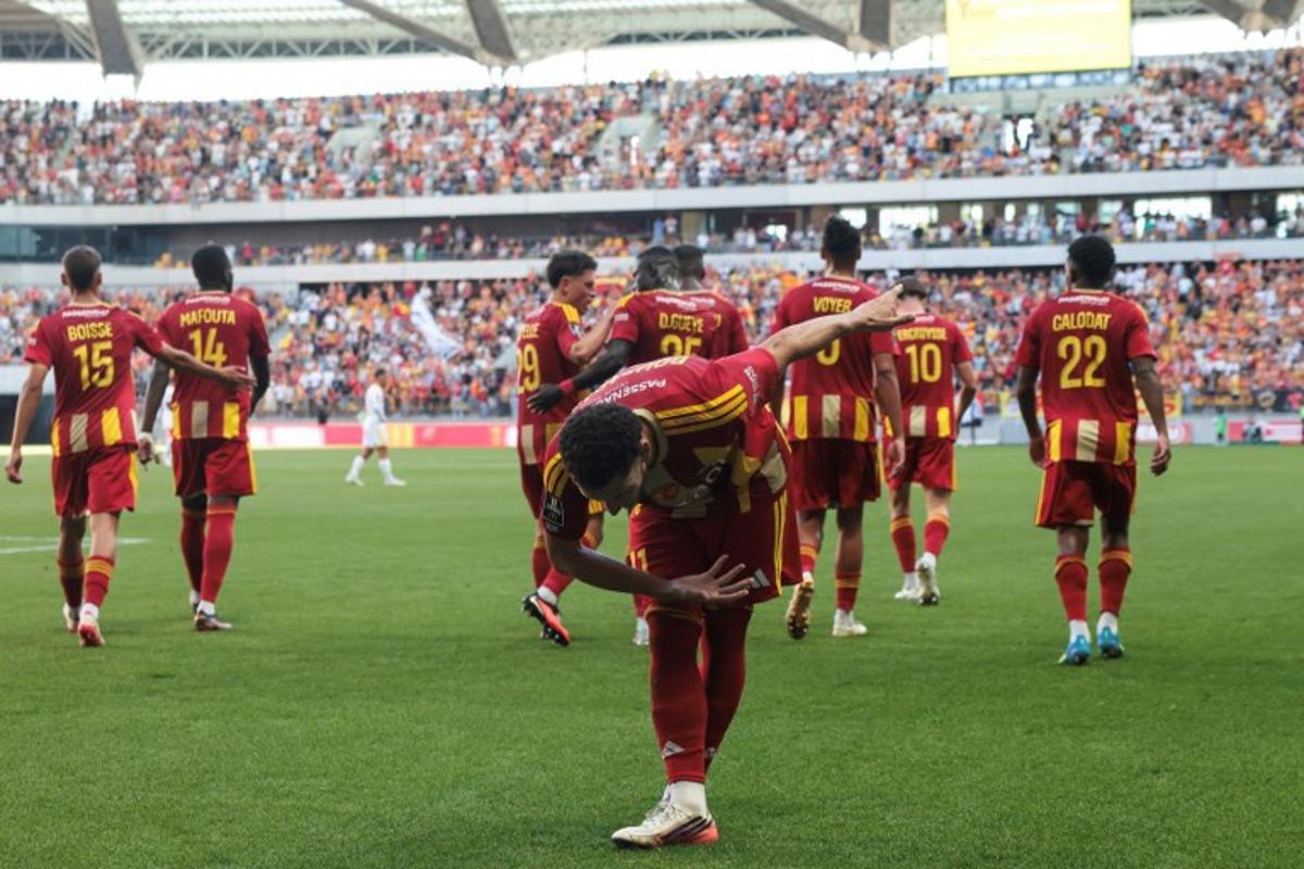 Le Mans' Algerian midfielder #11 Adil Bourabaa celebrates scoring his team first goal during the French L1 football match between Le Mans FC and Racing Club de Lens (RCL) at the Stade Marie-Marvingt in Le Mans on September 13, 2026. Alain JOCARD / AFP