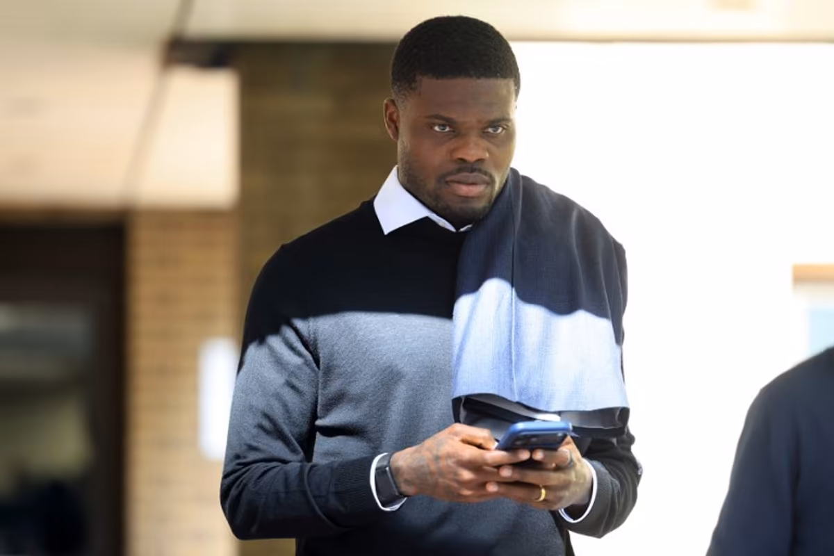Former Arsenal midfielder Thomas Partey departs following his hearing at the Southwark Crown Court in London on April 13, 2026. Partey, who now plays for Spanish club Villarreal, was charged in February with two further counts of rape. Toby Shepheard / AFP