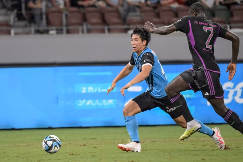 Kawasaki Frontale's Shin Yamada (L) fights for the ball with Bayern Munich's Dayot Upamecano during the football friendly match between Japan's Kawasaki Frontale and Germany's Bayern Munich at the National Stadium in Tokyo on July 29, 2023. Richard A. Brooks / AFP