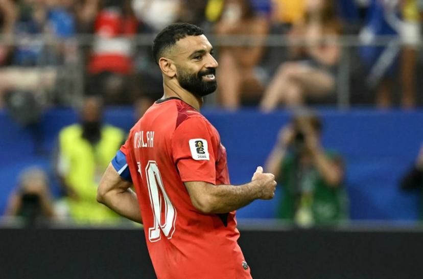 Egypt's forward #10 Mohamed Salah reacts after scoring in a penalty shoot-out during the 2026 World Cup round of 32 football match between Australia and Egypt at the Dallas Stadium in Arlington on July 3, 2026. Paul ELLIS / AFP
