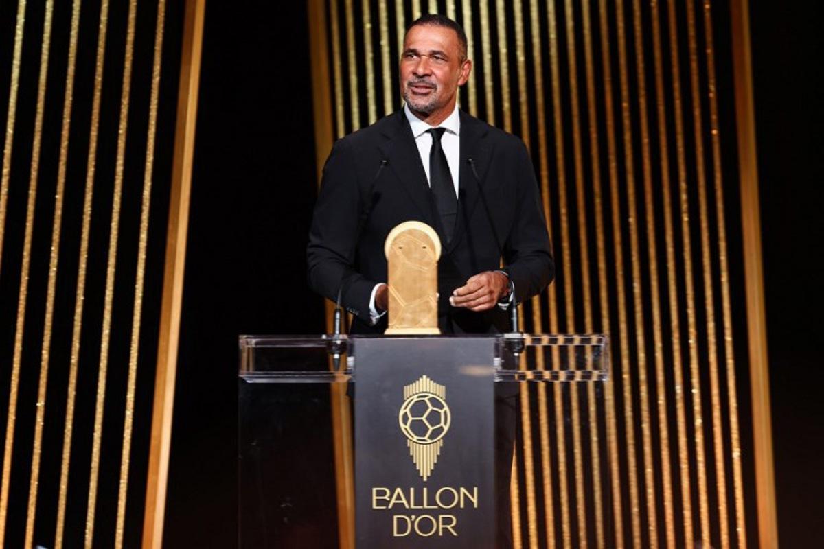 Former Dutch football player Ruud Gullit speaks on stage to give the Kopa Trophy for best under-21 player during the 2024 Ballon d'Or France Football award ceremony at the Theatre du Chatelet in Paris on October 28, 2024. FRANCK FIFE / AFP