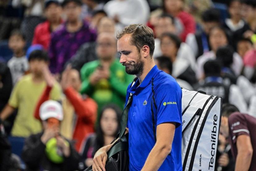Russia's Daniil Medvedev walks off the court after being disqualified for hitting a ball into the stands, injuring a spectator, during the men's singles semi-final against Serbia's Novak Djokovic at the China Open tennis tournament in Beijing on October 5, 2026. GREG BAKER / AFP