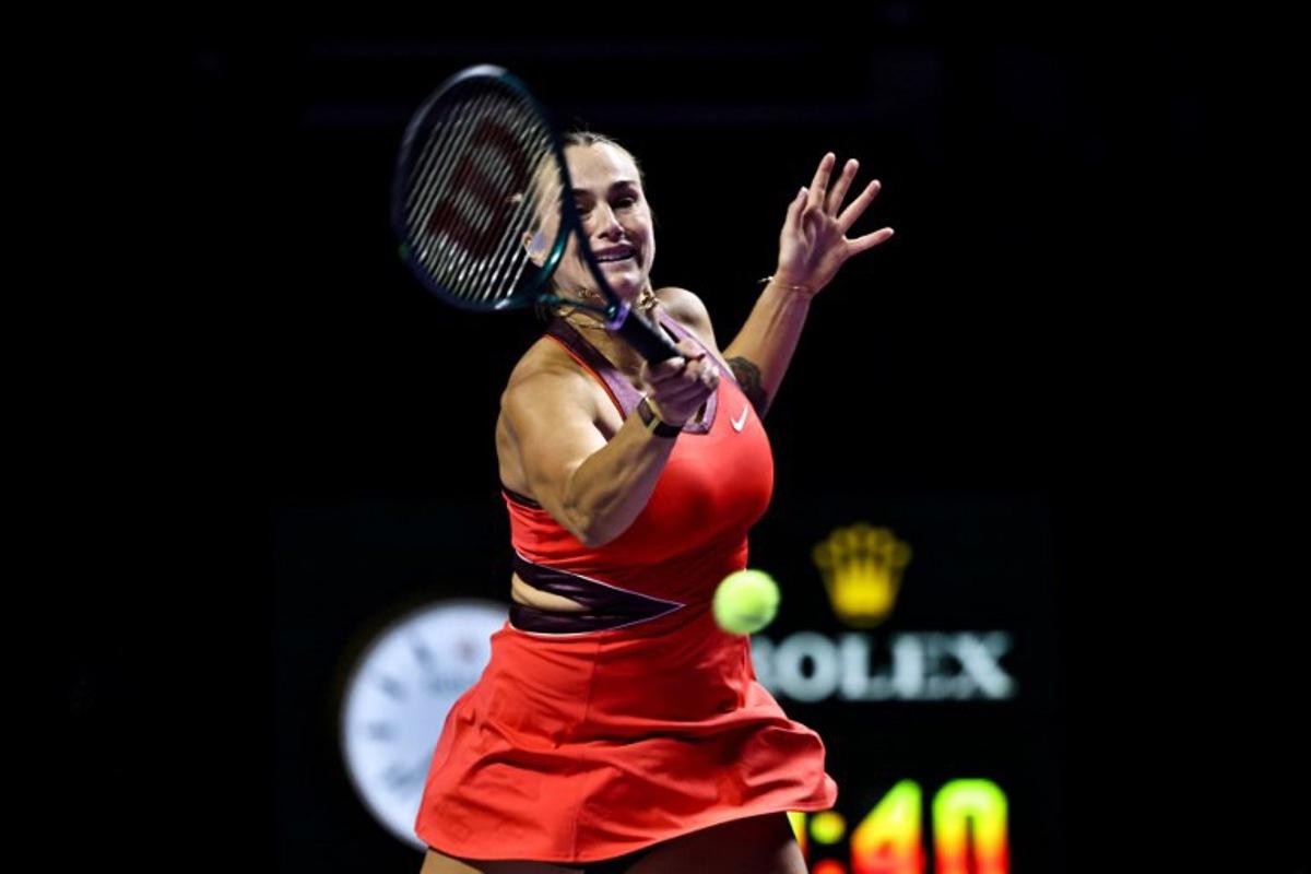 Belarus' Aryna Sabalenka hits a return against USA's Jessica Pegula during their tennis match at the WTA Finals in Riyadh on November 4, 2025. Fayez NURELDINE / AFP