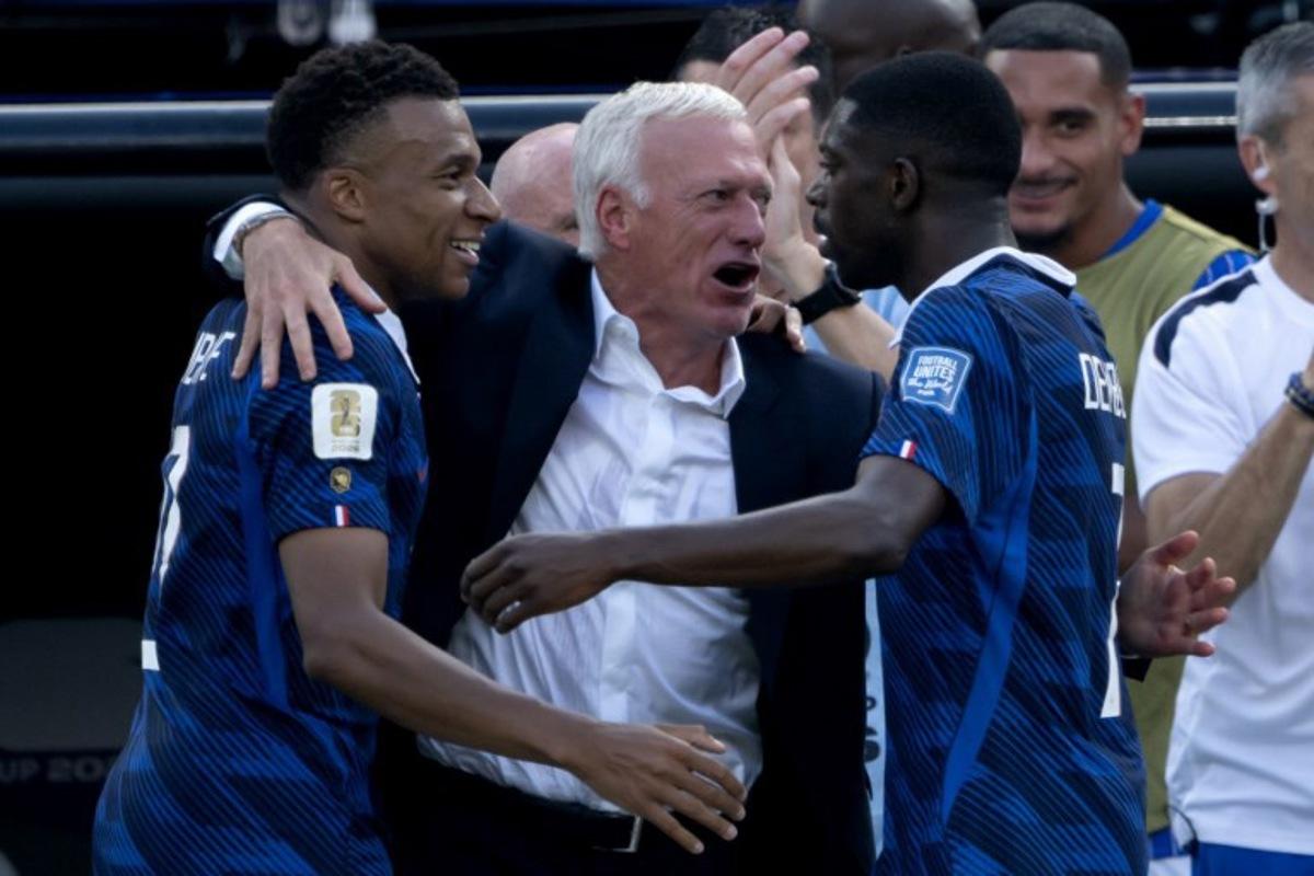 France's head coach Didier Deschamps celebrates with France's forward #10 Kylian Mbappe (L) and France's forward #07 Ousmane Dembele after the team scored the first goal during the 2026 World Cup round of 32 football match between France and Sweden at the New York/New Jersey Stadium in East Rutherford on June 30, 2026. Pedro UGARTE / AFP