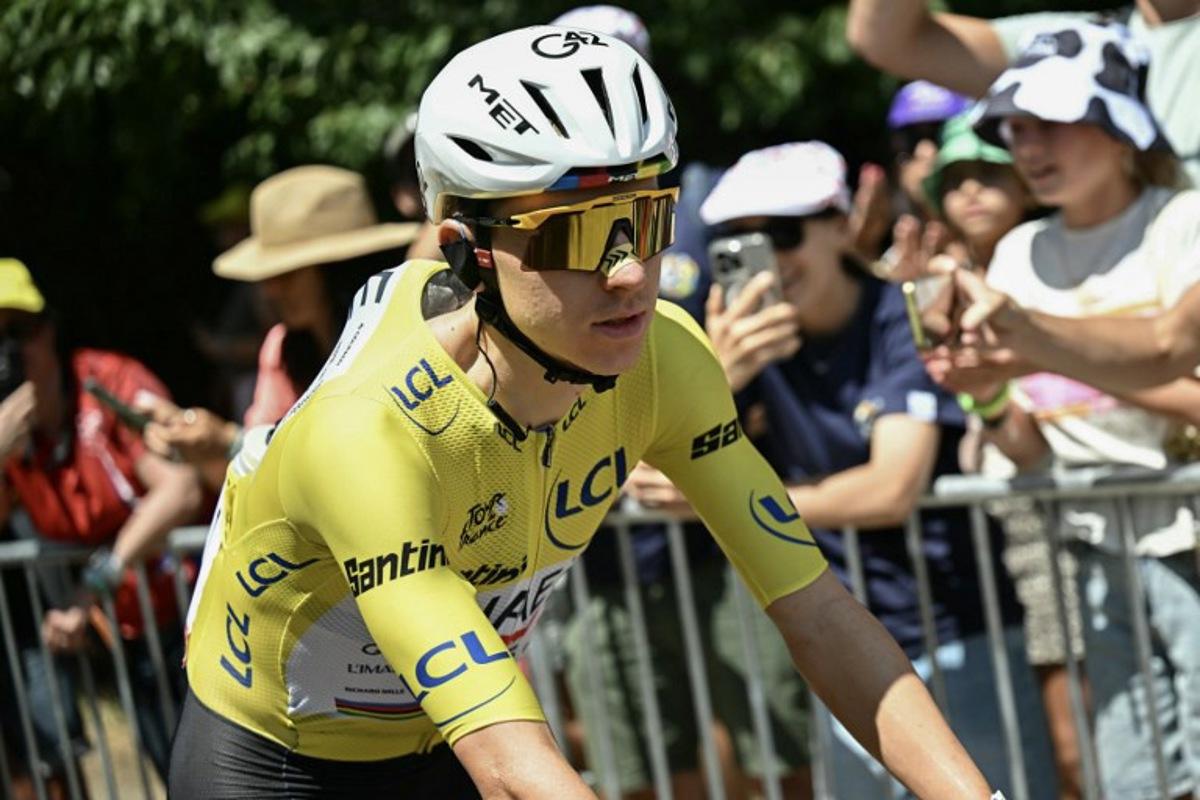 UAE Team Emirates - XRG's Slovenian rider Tadej Pogacar wearing the overall leader's yellow jersey awaits the start of the 19th stage of the 113th edition of the Tour de France cycling race, 127,9 km between Gap and Alpe d'Huez in the French Alps, on July 24, 2026. Loic VENANCE / AFP