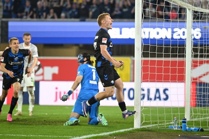 SC Paderborn's German defender #17 Laurin Curda celebrates his 2-1 during the German Bundesliga relegation second-leg football match between SC Paderborn 07 and VfL Wolfsburg in Heidenheim on May 22, 2025. Ina FASSBENDER / AFP