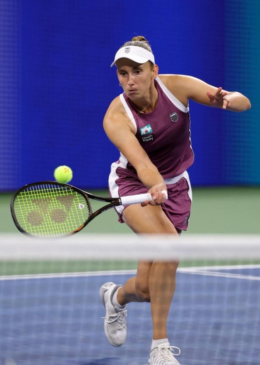 Belgium's Elise Mertens hits a return to Japan's Naomi Osaka in their women's singles third round tennis match on day seven of the US Open tennis tournament at the USTA Billie Jean King National Tennis Center in New York City on September 5, 2026. KENA BETANCUR / AFP