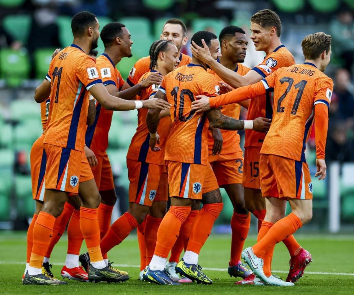 Netherland's forward #10 Memphis Depay (C) celebrates with teammates after scoring a goal during the FIFA World Cup 2026 Group G European qualification football match between the Netherlands and Malta at the Euroborg Stadium in Groningen on June 10, 2025. Koen Van WEEL / ANP / AFP