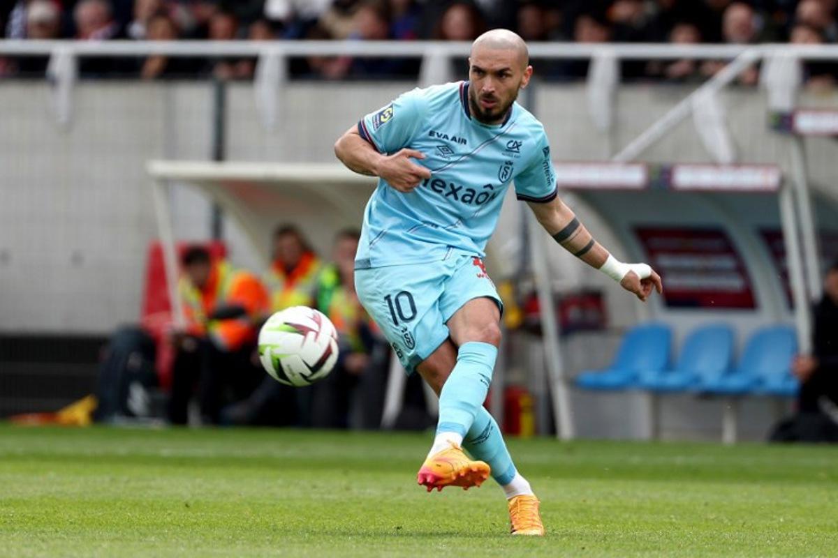 Reims' Maltese French midfielder #10 Teddy Teuma shoots the ball during the French L1 football match between Clermont Foot 63 and Stade de Reims at the Gabriel Montpied stadium in Clermont-Ferrand, central France, on April 28, 2024. ROMAIN PERROCHEAU / AFP