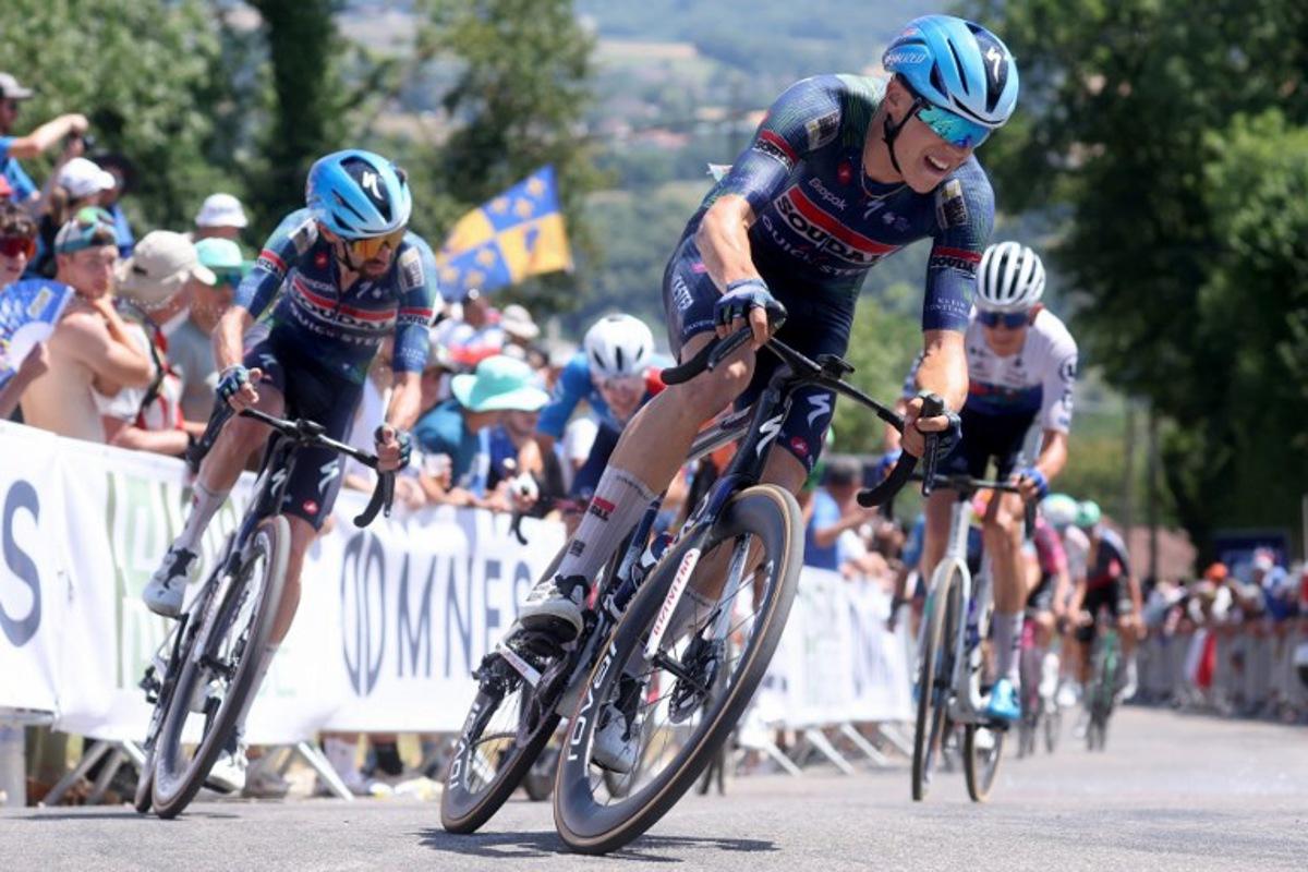 Soudal Quick-Step's French rider Paul Magnier (C) competes in the men's Elite Road Race, part of the French Cycling Championship 2026, near La Tour du Pin, central-eastern France on June 28, 2026. Alex MARTIN / AFP
