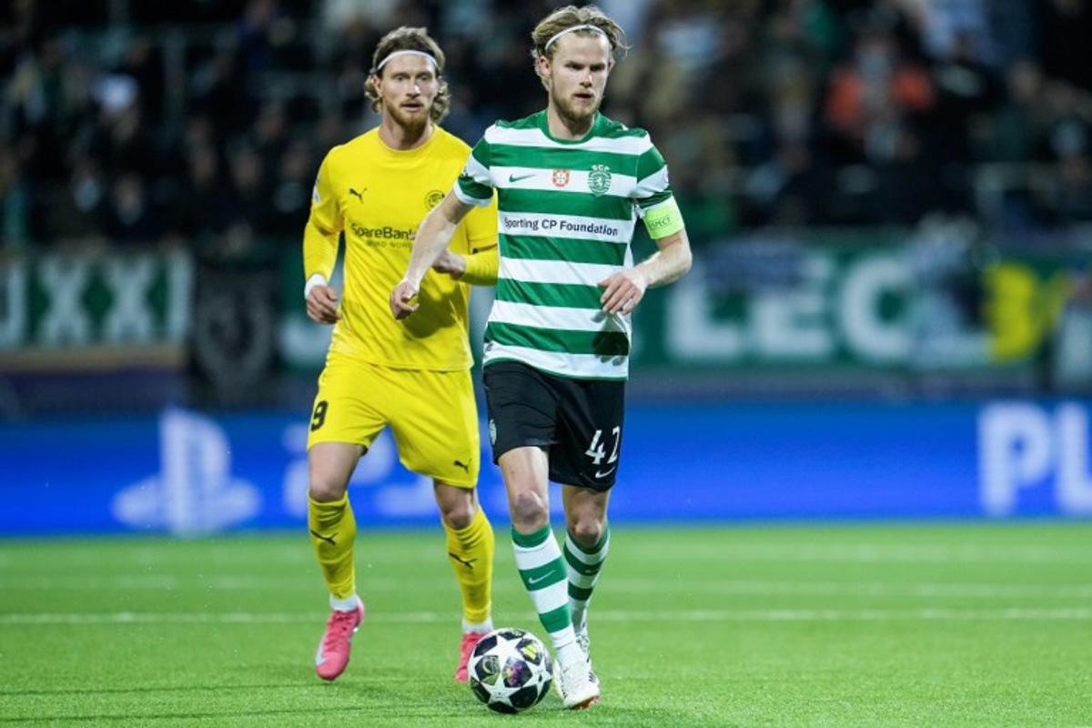 Sporting Lisbon's Danish midfielder #42 Morten Hjulmand and Bodo/Glimt's Danish forward #09 Kasper Waarst Hogh vie for the ball during the UEFA Champions League, Last 16, first-leg football match Bodo/Glimt vs Sporting CP at the Aspmyra stadium, in Bodo, Norway on March 11, 2026. Fredrik Varfjell / NTB / AFP