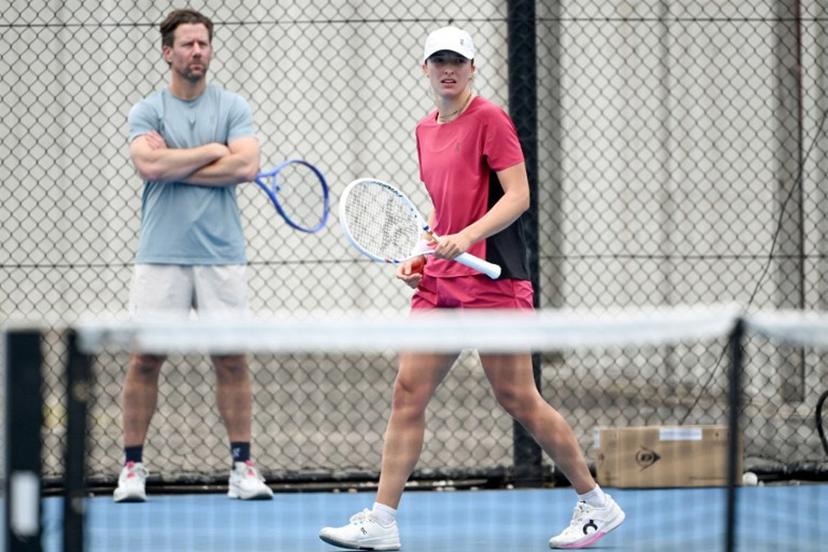 Poland's Iga Swiatek (R) attends a practice session ahead of the United Cup tennis tournament in Sydney on January 2, 2026. Saeed KHAN / AFP
