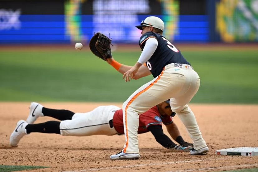 Arizona Diamondbacks' #11 Jose Fernandez dives back to first base past San Diego Padres' #30 Gavin Sheets during the MLB World Tour Mexico City Series game between the Arizona Diamondbacks and the San Diego Padres at Alfredo Harp Helu Stadium in Mexico City on April 26, 2026. YURI CORTEZ / AFP