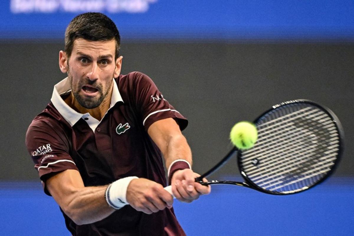 Serbia's Novak Djokovic hits a return to Australia's Alex de Minaur during the men's singles final at the China Open tennis tournament in Beijing on October 6, 2026 GREG BAKER / AFP