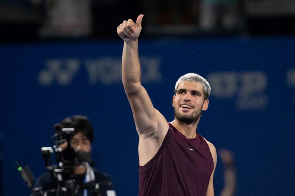 Spain's Carlos Alcaraz reacts after his men's singles match against Norway's Casper Ruud at the ATP Japan Open tennis tournament in Tokyo on September 29, 2025. Philip FONG / AFP