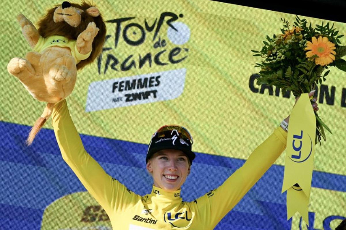 Yellow jersey of overall leader Team SD Worx-Protime's Dutch rider Lorena Wiebes poses on the podium after she won the first (out of 9) stage of the fifth edition of the Women's Tour de France cycling race, 138 km from Lausanne to Lausanne on August 1, 2026. NICOLAS TUCAT / AFP