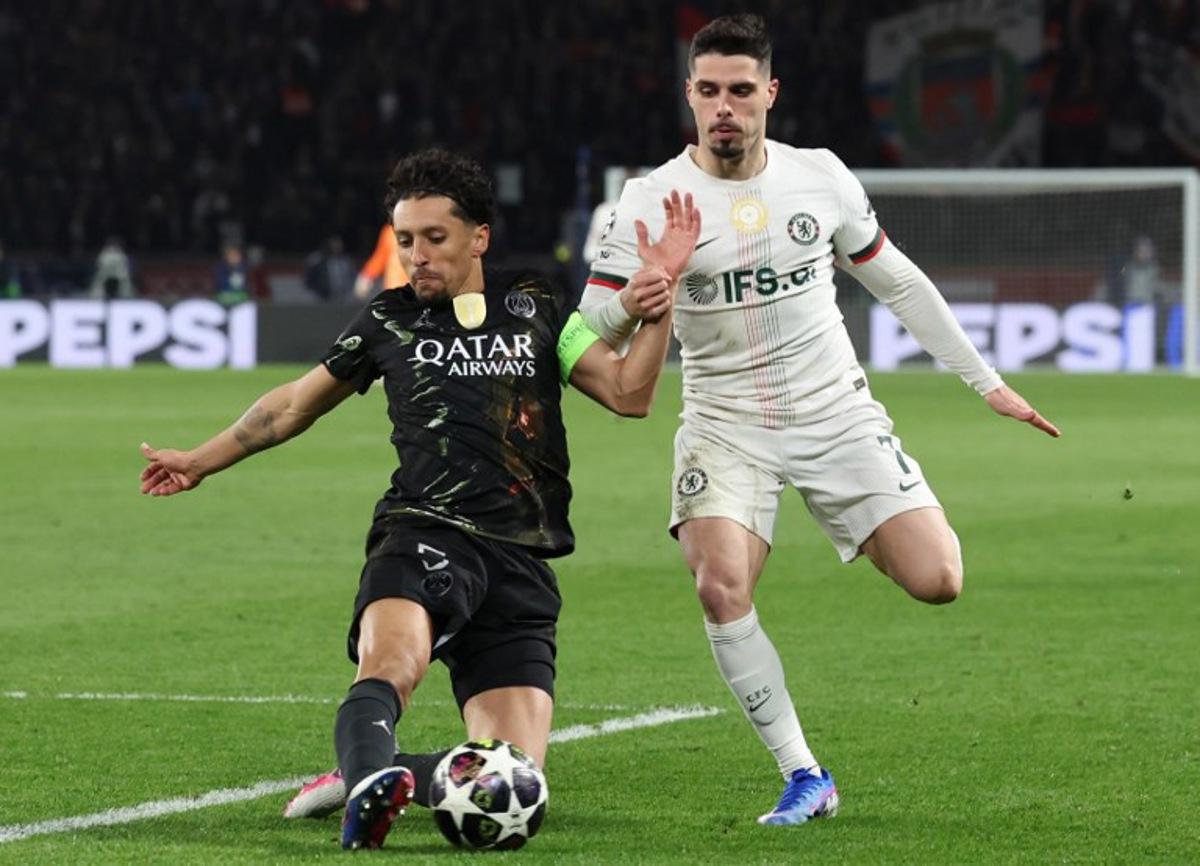 Paris Saint-Germain's Brazilian defender #05 Marquinhos (L) defends against Chelsea's Portuguese forward #07 Pedro Neto during the UEFA Champions League round of 16 first leg football match between Paris Saint-Germain (PSG) and Chelsea at the Parc des Princes stadium in Paris on March 11, 2026. Alain JOCARD / AFP