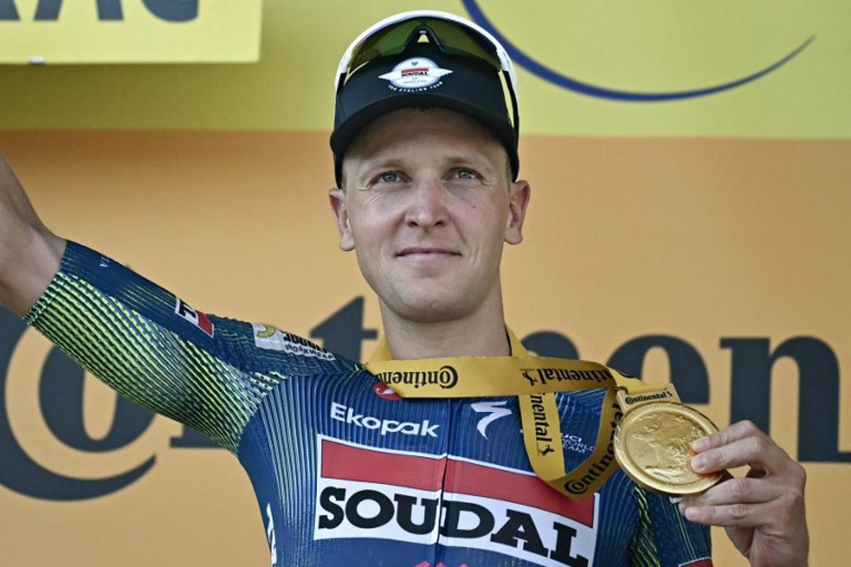 Soudal Quick-Step team's Belgian rider Tim Merlier celebrates on the podium after winning the 8th stage of the 113th edition of the Tour de France cycling race, 182 km between Périgueux and Bergerac in southwestern France, on July 11, 2026. Loic VENANCE / AFP