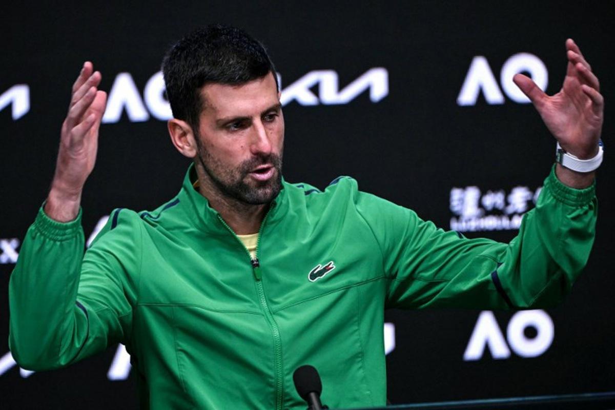 Serbia's Novak Djokovic speaks during a press conference after his defeat against Spain's Carlos Alcaraz in their men's singles final match on day fifteen of the Australian Open tennis tournament in Melbourne on February 1, 2026. WILLIAM WEST / AFP