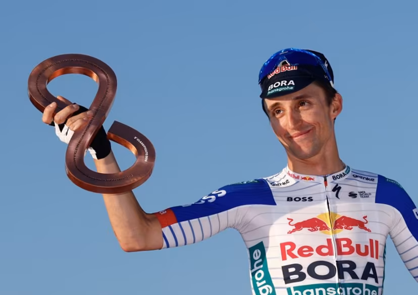 Third placed Red Bull - BORA - hansgrohe Australian rider Jai Hindley celebrates on the podium of the Giro d'Italia 2026 - Tour of Italy, in Rome, Italy, on May 31, 2026 Luca Bettini / AFP