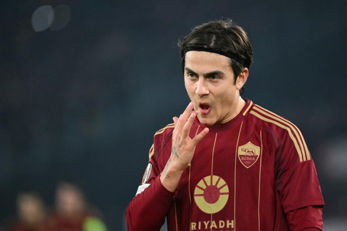 Roma's Argentine forward #21 Paulo Dybala reacts during the UEFA Europa League knockout round play-off 2nd leg football match between AS Roma and FC Porto at the Olympic stadium in Rome, on February 20, 2025. Alberto PIZZOLI / AFP