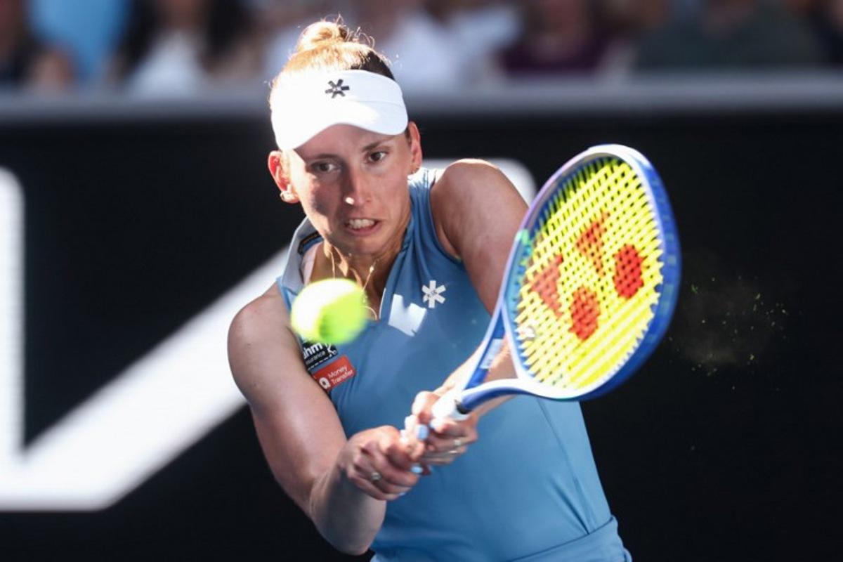 Belgium's Elise Mertens hits a return to Kazakhstan's Elena Rybakina during their women's singles match on day nine of the Australian Open tennis tournament in Melbourne on January 26, 2026. IZHAR KHAN / AFP