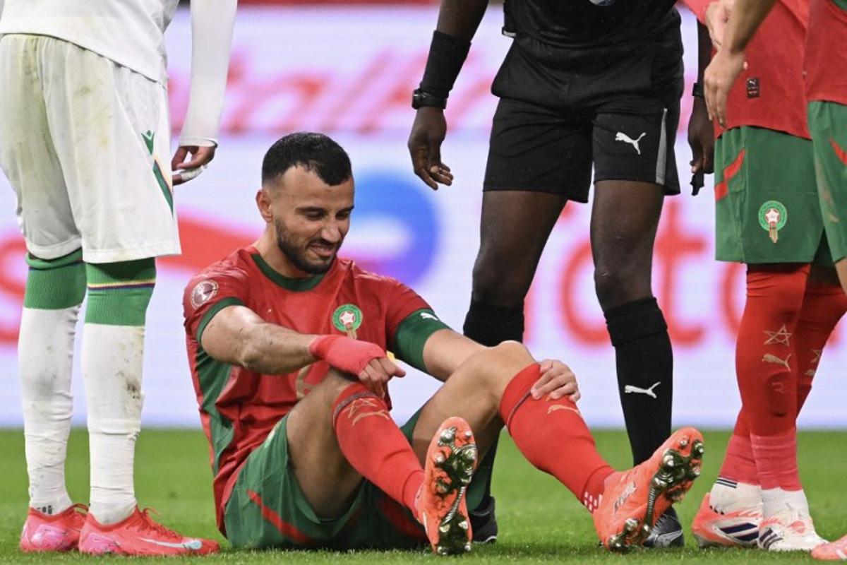 Morocco's defender #06 Romain Ghanem Saiss grimaces during the Africa Cup of Nations (CAN) group A football match between Morocco and Comoros at Prince Moulay Abdellah Stadium in Rabat on December 21, 2025. SEBASTIEN BOZON / AFP