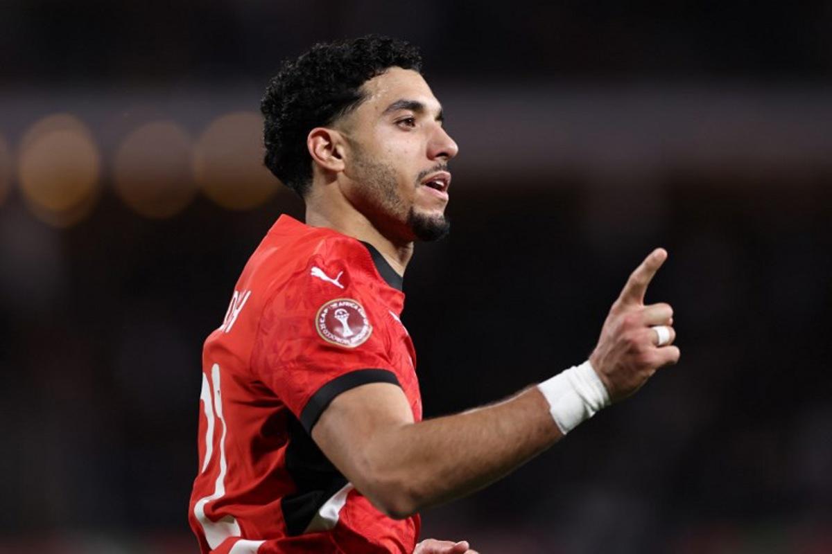 Egypt's forward #22 Omar Marmoush celebrates scoring the team's first goal during the Africa Cup of Nations (CAN) group B football match between Egypt and Zimbabwe at Adrar Stadium in Agadir on December 22, 2025. FRANCK FIFE / AFP