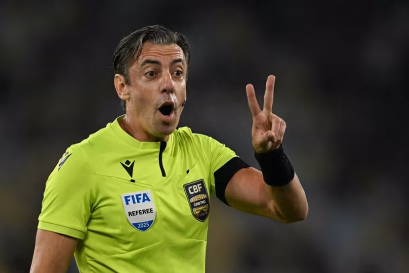 Brazilian referee Raphael Claus gestures during the Brasileirao Serie A football match between Vasco da Gama and Fluminense at the Maracana Stadium in Rio de Janeiro, Brazil, on March 18, 2026. MAURO PIMENTEL / AFP