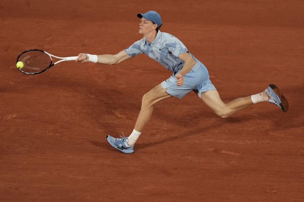 Italy's Jannik Sinner plays a forehand return to France's Clement Tabur during their men's singles match on day 3 of the French Open tennis tournament on Court Philippe-Chatrier at the Roland-Garros Complex in Paris on May 26, 2026. Dimitar DILKOFF / AFP