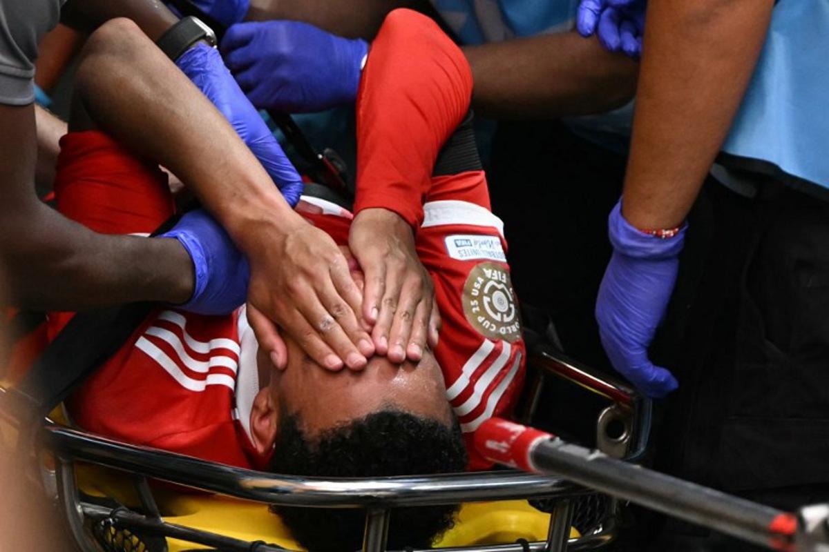 Bayern Munich's German midfielder #42 Jamal Musiala leaves the pitch during the FIFA Club World Cup 2025 quarterfinal football match between France's Paris Saint-Germain and Germany's Bayern Munich at the Mercedes-Benz Stadium in Atlanta on July 5, 2025. PATRICIA DE MELO MOREIRA / AFP