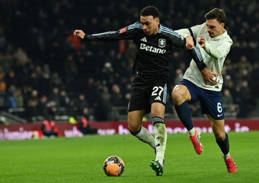 Tottenham Hotspur's Portugese midfielder #06 Joao Palhinha (R) vies with Aston Villa's English midfielder #27 Morgan Rogers during the English third round FA Cup football match between Tottenham Hotspur and Aston Villa at Tottenham Hotspur Stadium in London, on January 10, 2026. Glyn KIRK / AFP