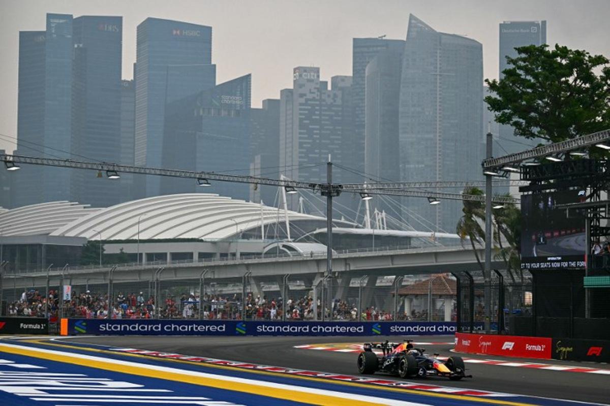 Red Bull Racing's Dutch driver Max Verstappen warms-up before the start of the sprint race ahead of the Formula One Singapore Grand Prix at the Marina Bay Street Circuit in Singapore on October 10, 2026. Lillian SUWANRUMPHA / AFP