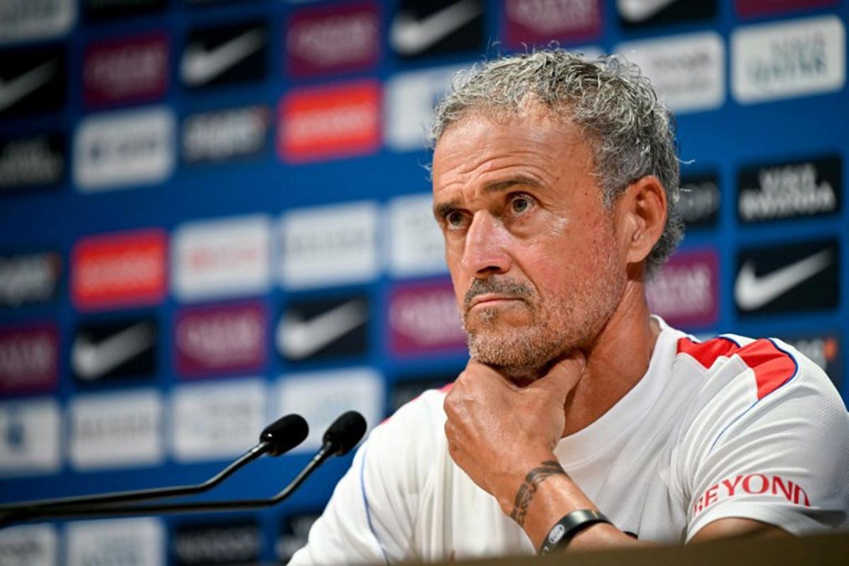 PSG's Spanish headcoach Luis Enrique looks on as he delivers a press conference following a training session at the Paris Saint-Germain's campus in Poissy, west of Paris on August 15, 2026, on the eve of their French Super Cup (Trophee des Champions) football match against RC Lens. LOU BENOIST / AFP