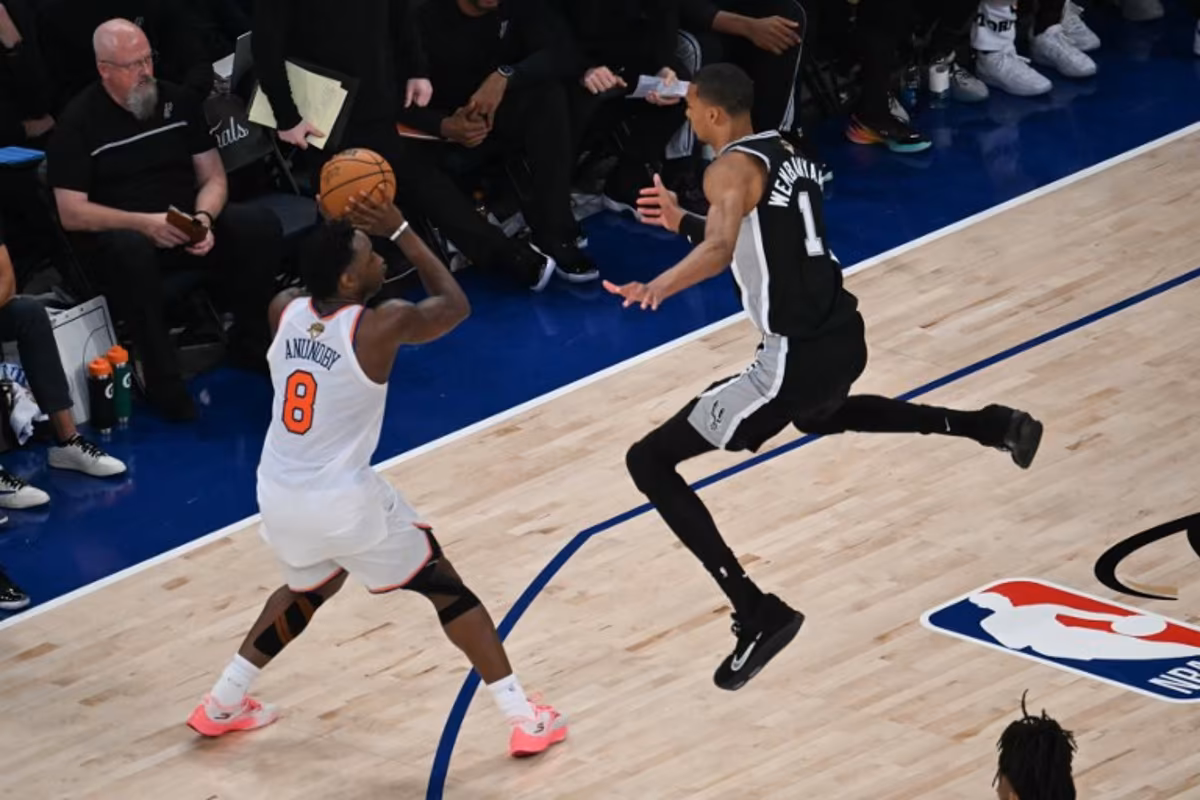 San Antonio Spurs' French forward-center #01 Victor Wembanyama jumps as Nicks' British-US player #08 OG Anunoby prepares to throw during Game Three of the NBA Finals between the San Antonio Spurs and the New York Knicks at Madison Square Garden in New York on June 8, 2026. SAUL LOEB / AFP