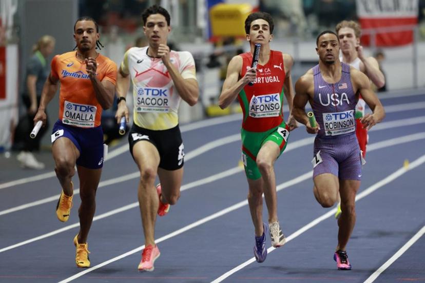 Netherlands' Eugene Omalla (L), Belgium's Jonathan Sacoor, Portugal's Pedro Afonso and USA's Justin Robinson compete in the men's final 4x400 metres relay event during the World Athletics Indoor Championships Kujawy Pomorze 2026 in Torun, Poland on March 22, 2026. Wojtek RADWANSKI / AFP
