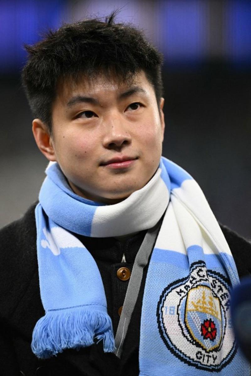 Chinese snooker player Zhao Xintong poses ahead of the UEFA Champions League league-stage football match between Manchester City and Bayer Leverkusen at the Etihad Stadium in Manchester, north west England, on November 25, 2025. Oli SCARFF / AFP