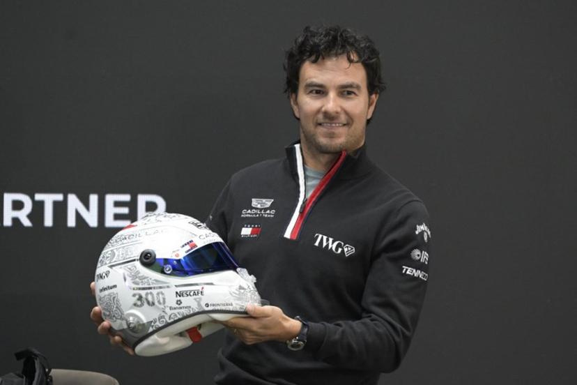 Mexican F1 driver Sergio Perez of Cadillac Team shows his helmet during a press conference in Mexico City, on October 27, 2026, ahead of the upcoming Mexico GP. Alfredo ESTRELLA / AFP