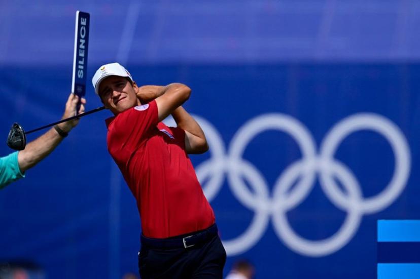 Belgium's Adrien Dumont de Chassart tees off in round 2 of the men's golf individual stroke play of the Paris 2024 Olympic Games at Le Golf National in Guyancourt, south-west of Paris on August 2, 2024. John MACDOUGALL / AFP