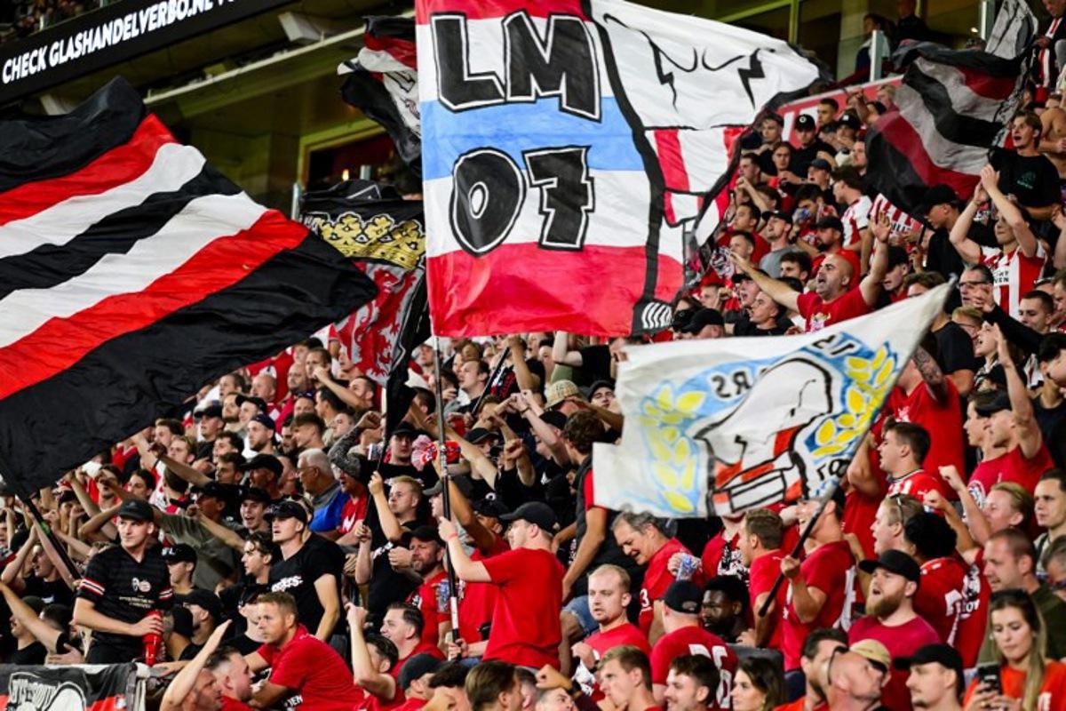 PSV fans cheer their team on from the stands during the the Dutch Eredivisie match between PSV Eindhoven and Sparta Rotterdam at the Phillips Stadium in Eindhoven on August 9, 2025. Olaf Kraak / ANP / AFP