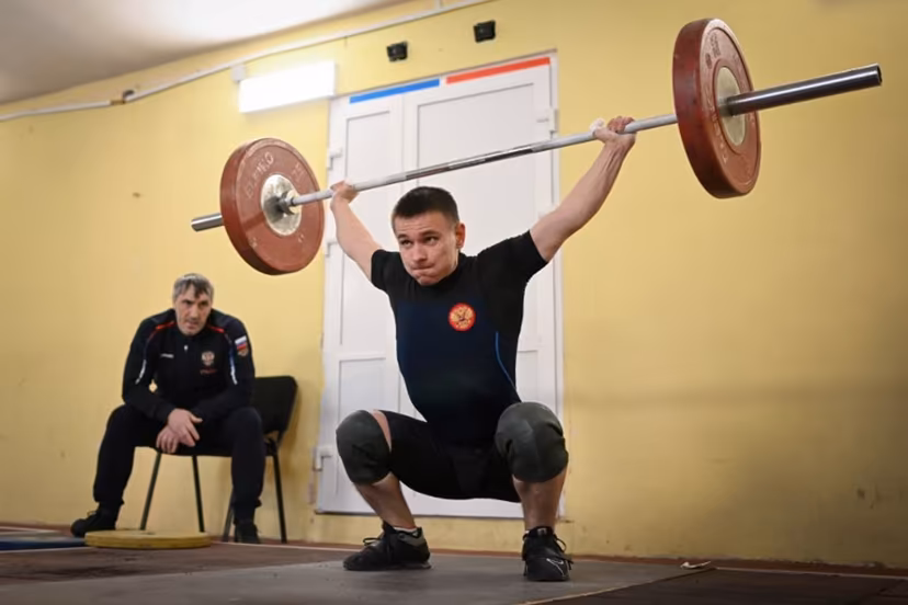 Russian weightlifter Oleg Musokhranov, 28, warms up before competing in his under 61kg category at the Russia Cup in Tula on January 28, 2024. Natalia KOLESNIKOVA / AFP