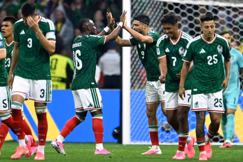 Mexico's forward #09 Raul Jimenez celebrates with teammate forward #16 Julian Quinones scoring his team's second goal during the 2026 World Cup round of 32 football match between Mexico and Ecuador at the Mexico City Stadium in Mexico City on June 30, 2026. CARL DE SOUZA / AFP